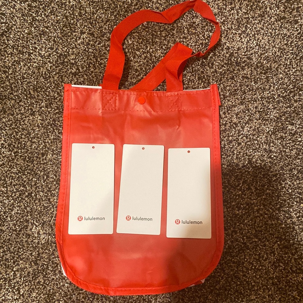 Red lululemon bag and three tags